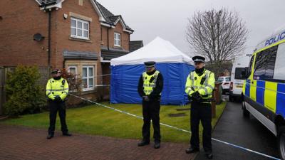 Police officers outside Peter Murrell's home in Glasgow