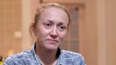 Iryna Doroshkevych sitting at the kitchen table