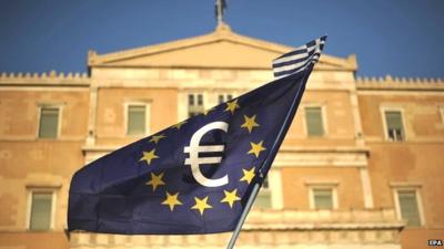 European flag with the euro sign is waved during a pro euro rally in front of the Greek Parliament in Athens