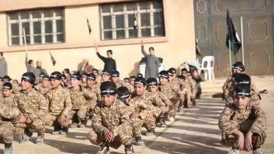 A frame from an IS propaganda video shows children in training