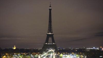 The Eiffel Tower with its lights turned off following the deadly attacks in Paris