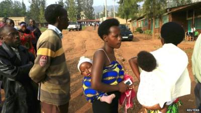 People wait to cast their votes at a polling station in Rwanda's capital, Kigali