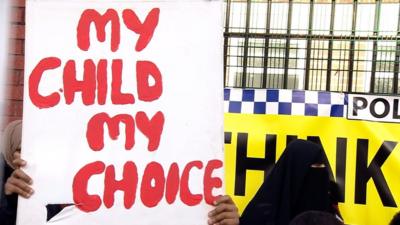 Protester holding a placard