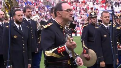 A French band play Oasis's Don't Look Back In Anger ahead of kick-off