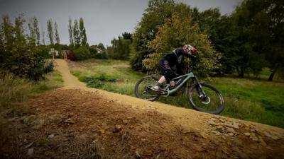 Cyclist on mountain bike course