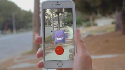 A new mobile game that lets players catch Pokemon as they roam the streets becomes a phenomenon.