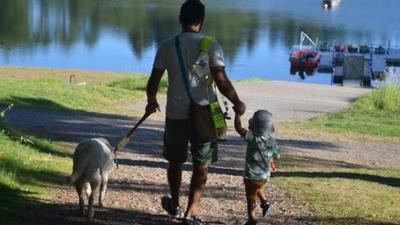 Amit Patel with his guide dog and son