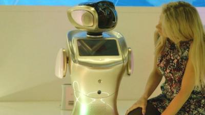 BBC Click's Jen Copestake (R) and a robot (L)