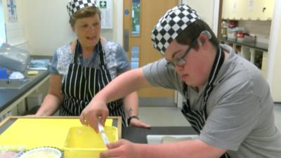 Young man working in kitchen