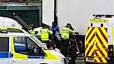 Migrants being arrested at Portsmouth Port