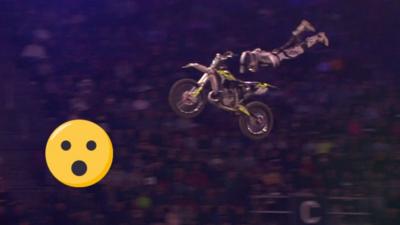 Motocross rider jumps