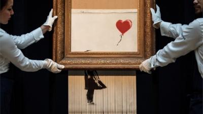 Banksy being shredded