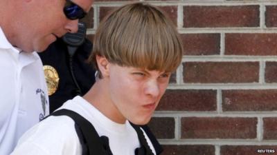 Police lead suspected shooter Dylann Roof, 21, into the courthouse in Shelby, North Carolina,