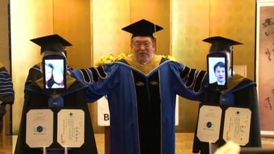 Students graduating at Tokyo’s Business Breakthrough University via telepresence robots