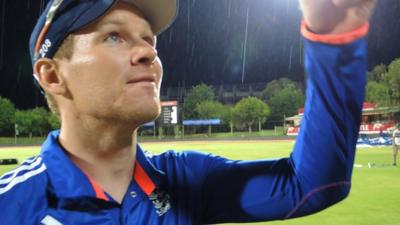 England captain Eoin Morgan's interview is halted by a thunderstorm