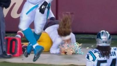 Redskins cheerleader knocked down by Cousins