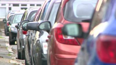 A line of parked cars