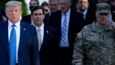 Mark Milley (R) walks with President Trump