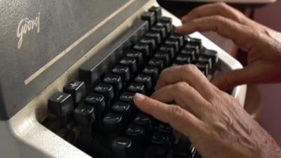 Ashok Abhyankar types on his typewriter