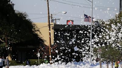 A town in California has been flooded with foam after a fire-protection system leaked everywhere.