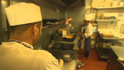 Two people cooking