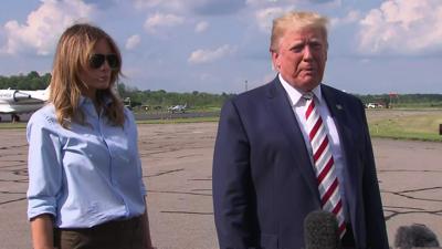 Donald Trump speaks to reporters the mass shootings before boarding Air Force One