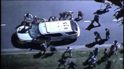 People surrounding car