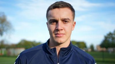 Head and shoulder shot of Josh Pesticcio in football kit