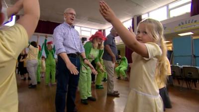 Young and old dance together