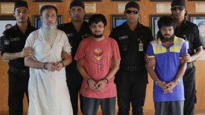 Suspected members of a banned Islamic militant outfit Ansarullah Bangla Team, Touhidur Rahman, second left, Sadek Ali, center and Aminul Mollick, second right