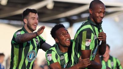 AFC Wimbledon celebrate their last-minute winner