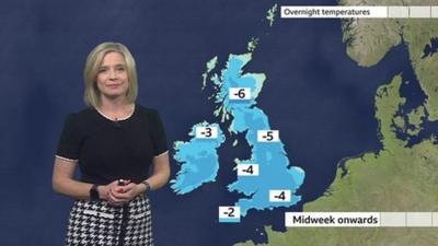 Sarah Keith-Lucas stands in front of a weather map of the UK