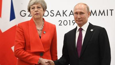 Theresa May and Vladimir Putin