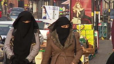 Two women walking along a Birmingham street