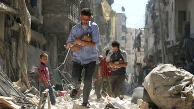 Children are taken out of rubble in Aleppo