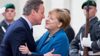 David Cameron greets Angela Merkel