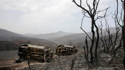 Burnt cars on the roadside after fire