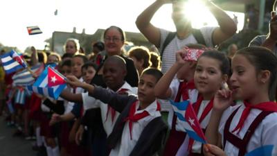 Crowds line the streets in Cuba