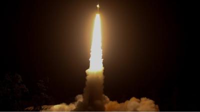 Rocket launching at night