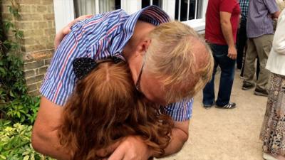 Philip Whaites hugging his granddaughter