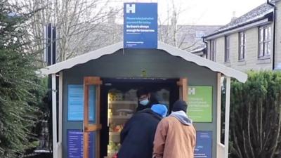 People queuing outside the Halifax community fridge