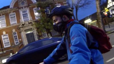 Cyclist wearing air pollution masks