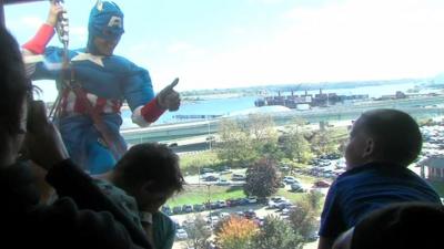 Window cleaner dressed as Captain America