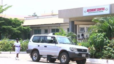 Nurse walks in front of an accident centre