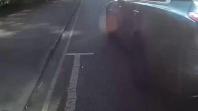 Car overtaking cyclist