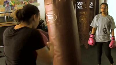 Women kick-boxing in Saudi Arabia