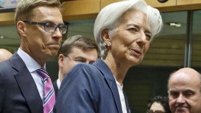 Finnish Finance Minister Alexander Stubb left, Managing Director of the International Monetary Fund Christine Lagarde, centre, and Spanish Economy Minister Luis de Guindos, right, arrive for a meeting of eurogroup finance ministers at the EU Lex building in Brussels on Sunday, July 12, 2015.