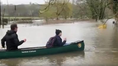 man and boy in boat