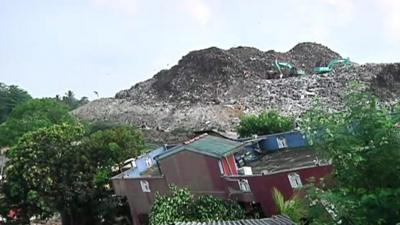 Rubbish dump and a destroyed home