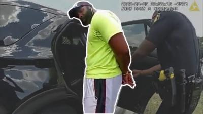 Jogger Mathias Ometu being arrested